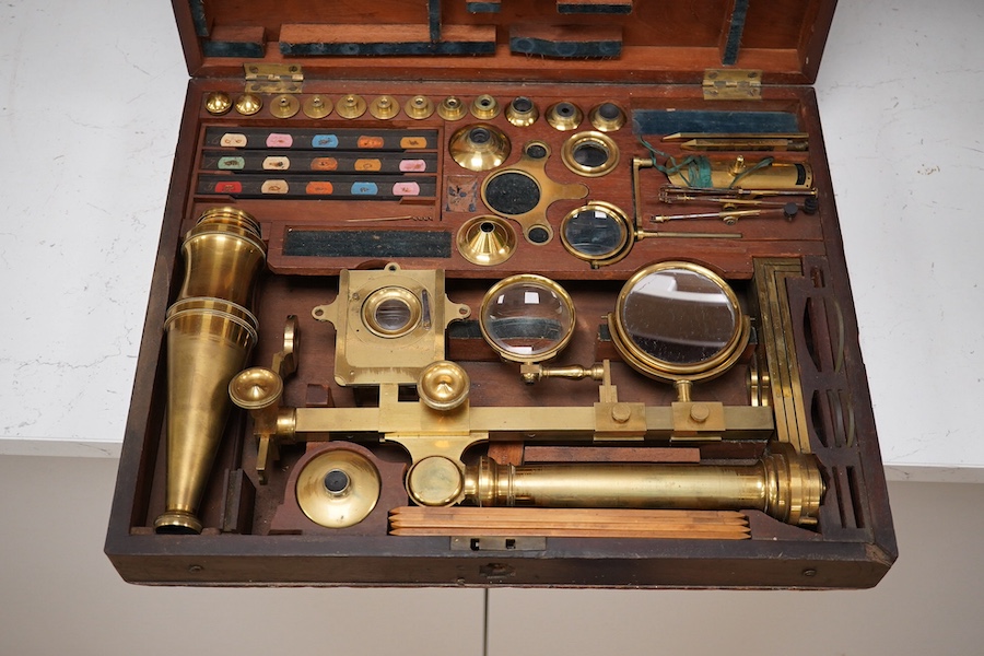 A mid 19th century folding compound and simple monocular microscope by William Harris & Co. 50 High Holborn, London, in its fitted mahogany case with paper maker’s label to inside of the lid. Condition - fair to good, so